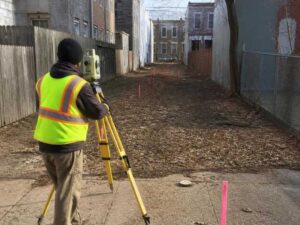 subdivision survey urban lots baltimore maryland - Baltimore Land Surveying Surveyor performing a subdivision survey on urban lots before redevelopment in Baltimore Maryland