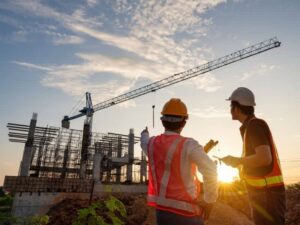 Construction professionals coordinating site layout during a commercial development project in Baltimore, MD
